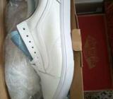 All white leather Vans Old Skool