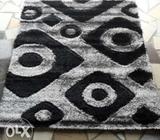 Grey and black shaggy center rug